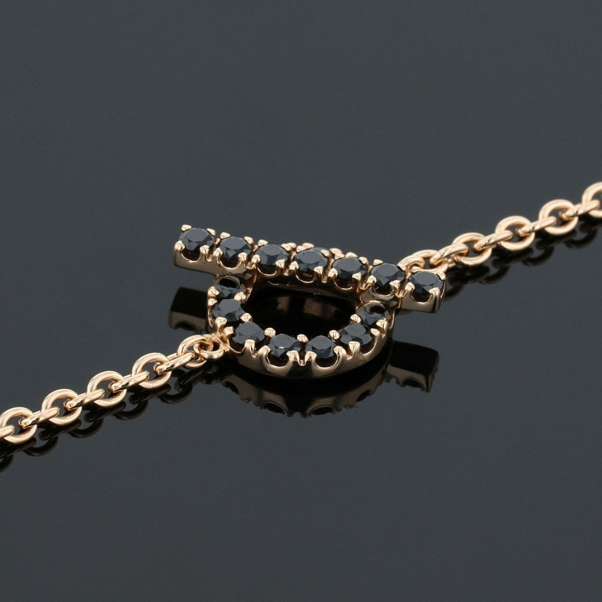 Hermes Finesse black spinels and gold bracelet