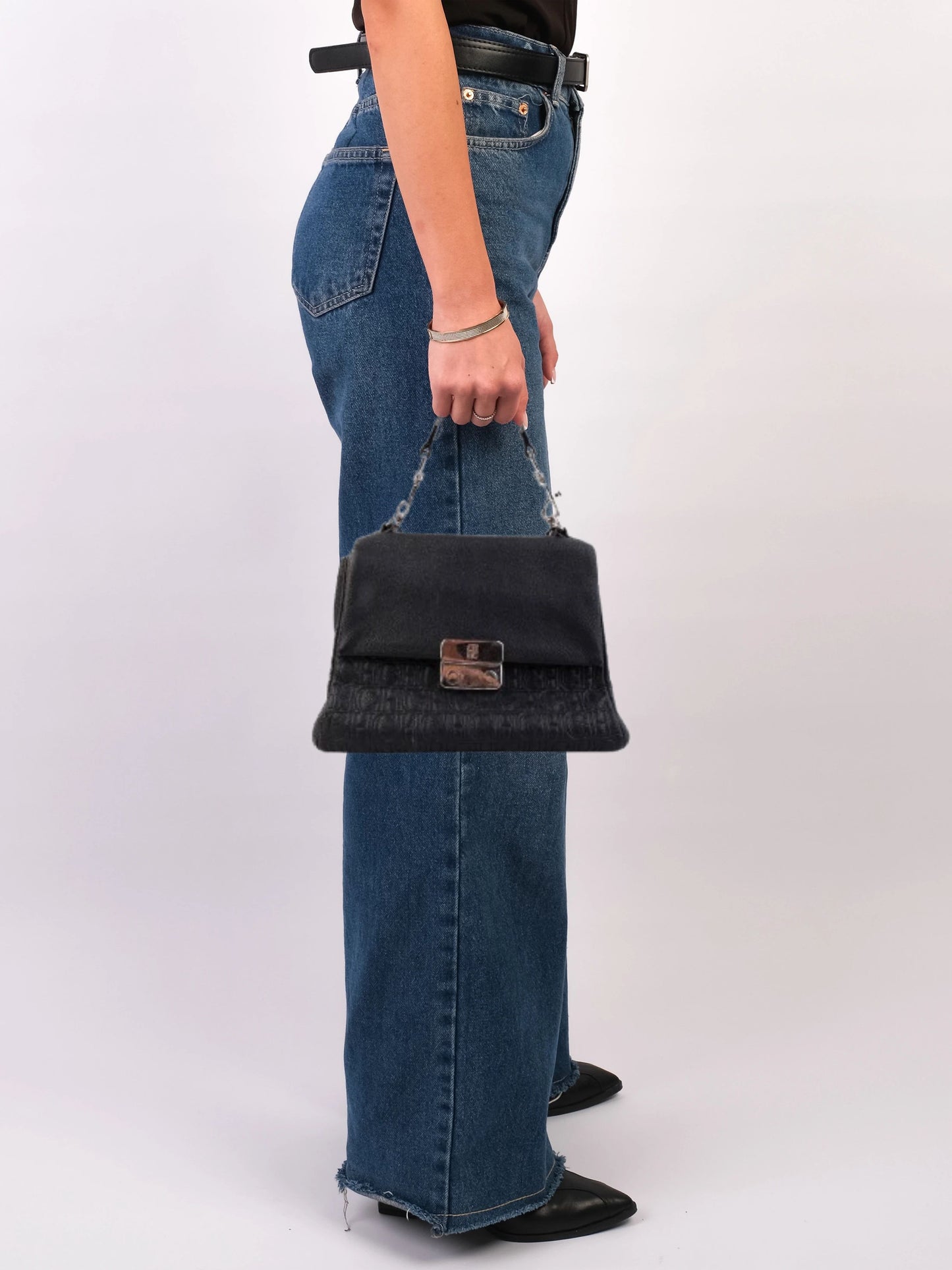 average carolina herrera black leather handbag with ch patterns