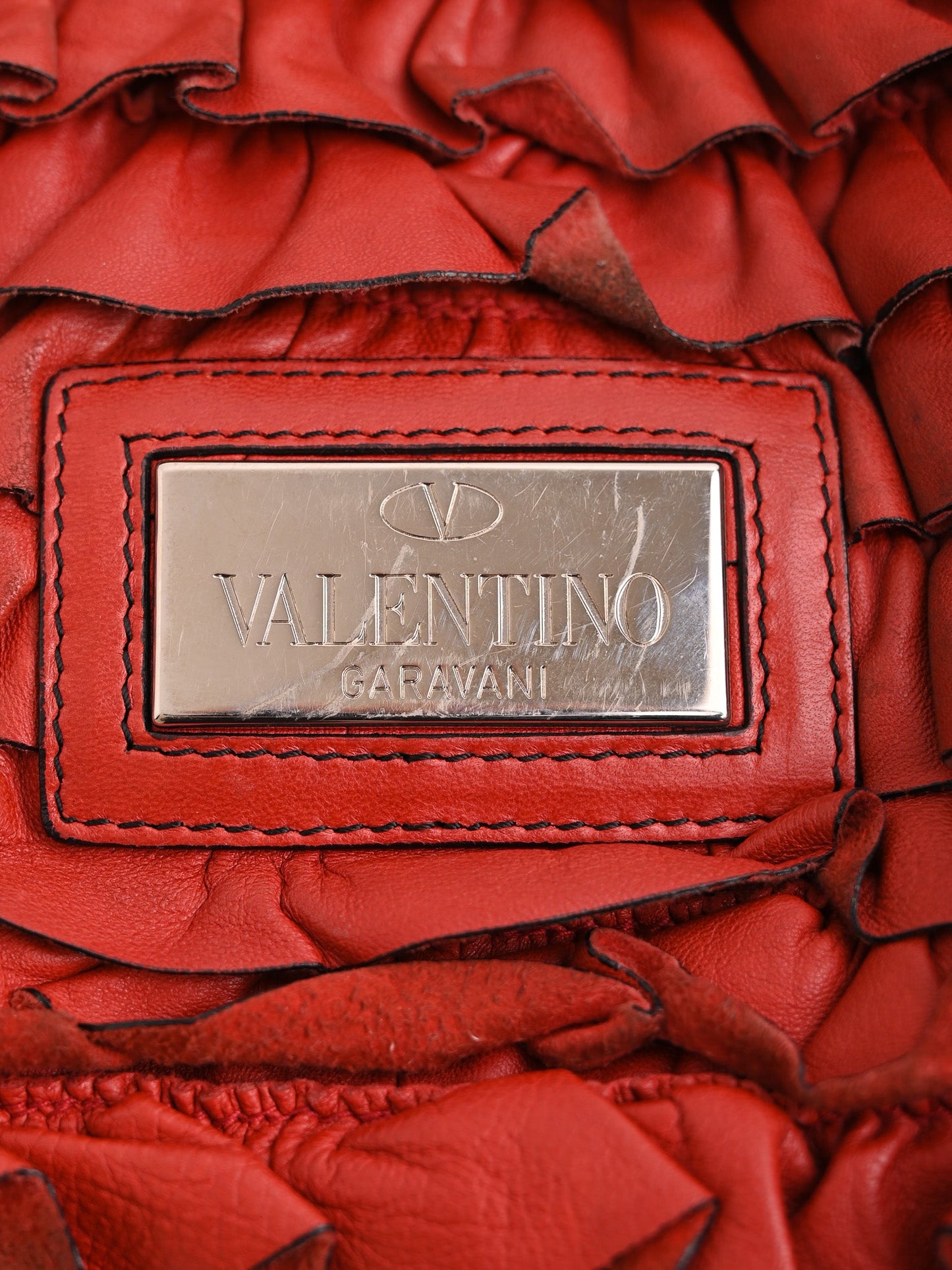 average condition valentino garavani red leather handbag