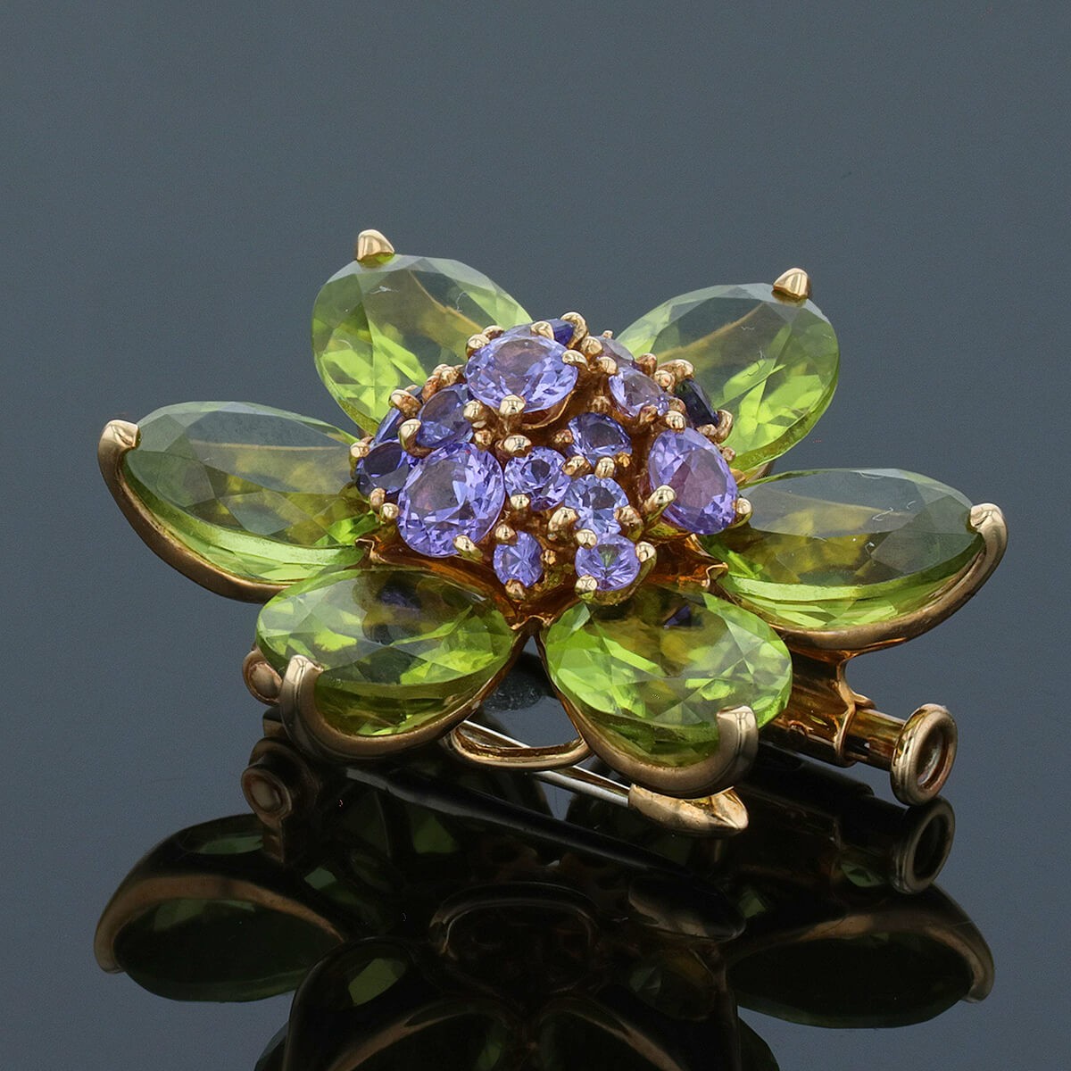 van cleef & arpels hawa peridots, amethysts and gold brooch