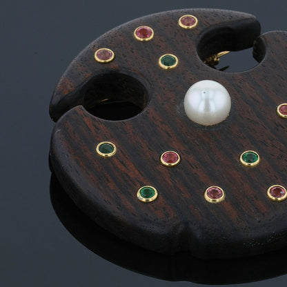 Wood, fine stones and gold brooch