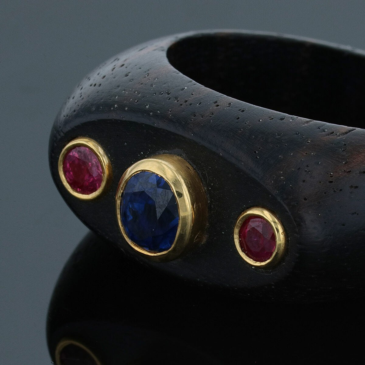 wood, sapphires, rubies and gold ring